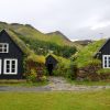 Two bungalows with greenery on the roof
