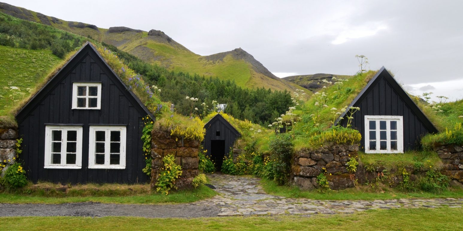 Two bungalows with greenery on the roof