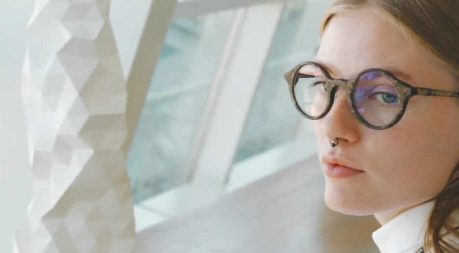 Woman wearing glasses made of coffee granules