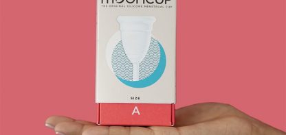 Hand holding mooncup box