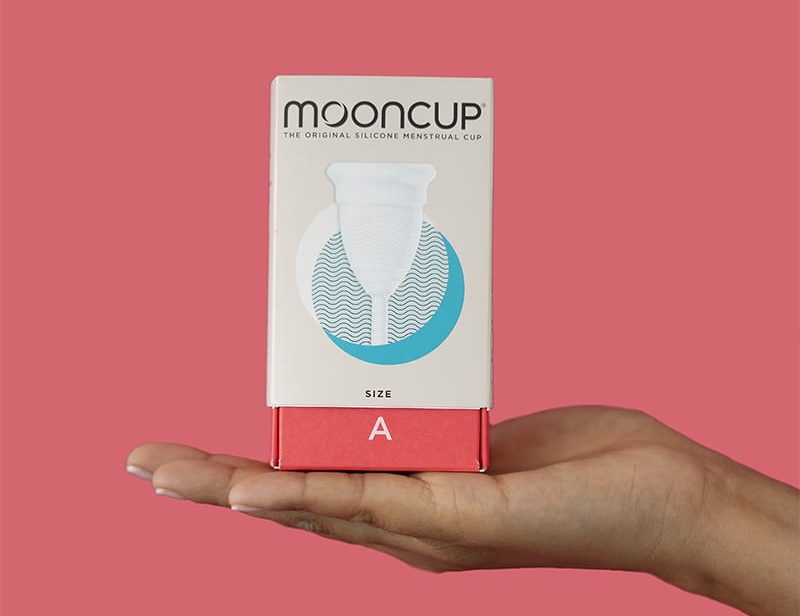 Hand holding mooncup box