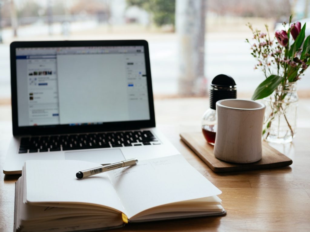 laptop, desk, coffee mug, window