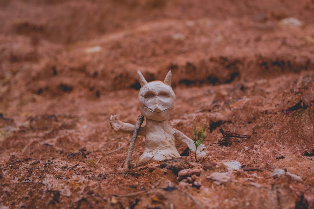 clay model of a mouse in clay field