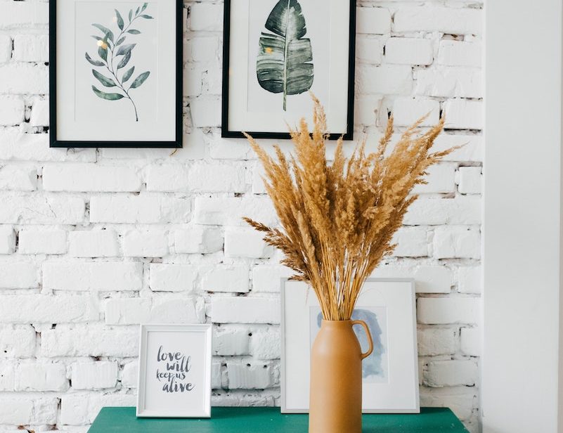 dresser, plant pot, picture frames