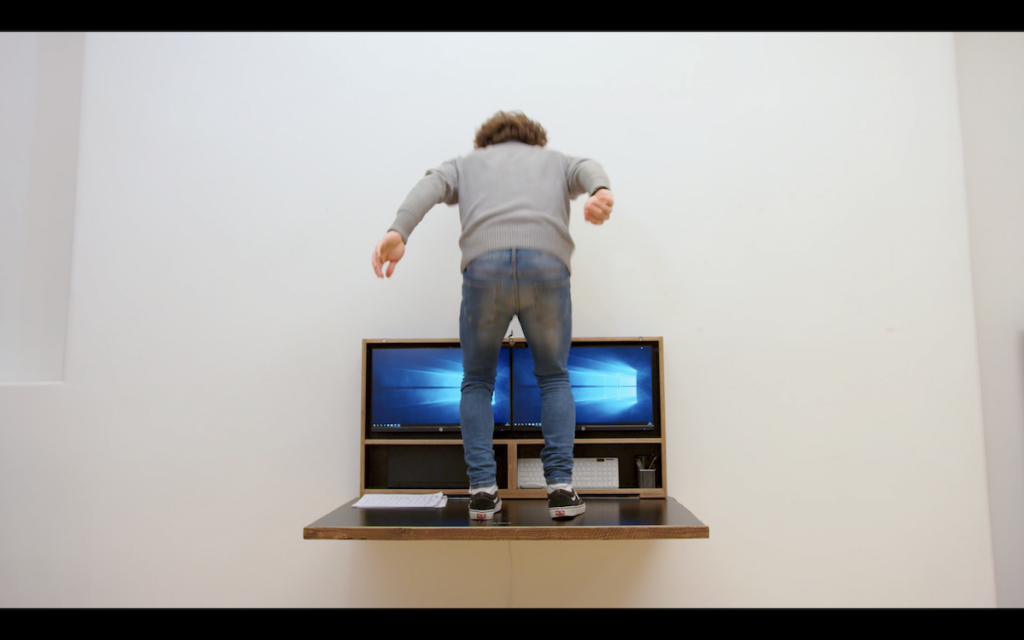 Man jumping on desk