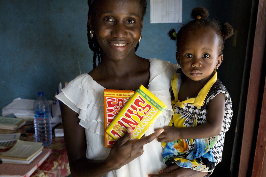 Woman with baby and chocolate bars