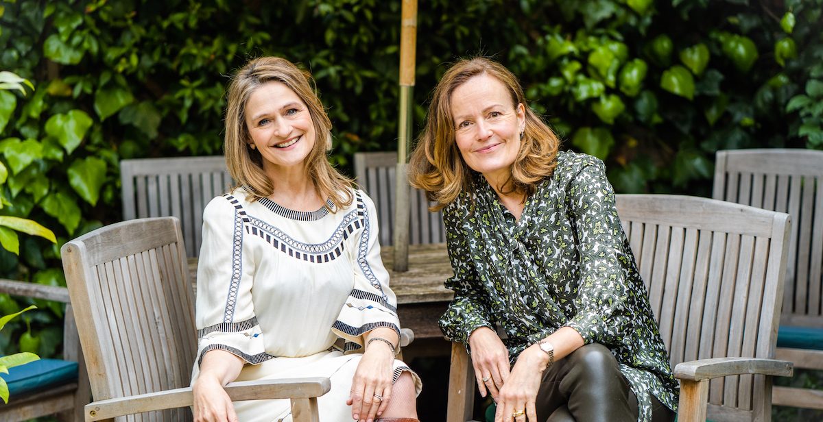 Two smiling women