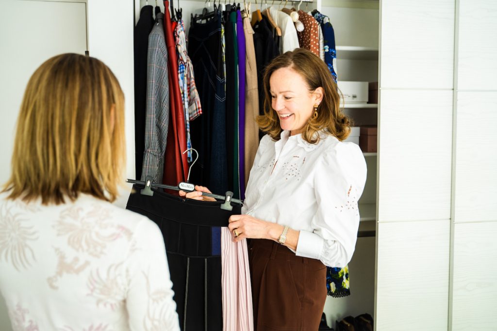 Two women looking at wardrobe