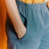 Close up of woman with hand in pocket