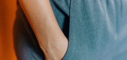 Close up of woman with hand in pocket