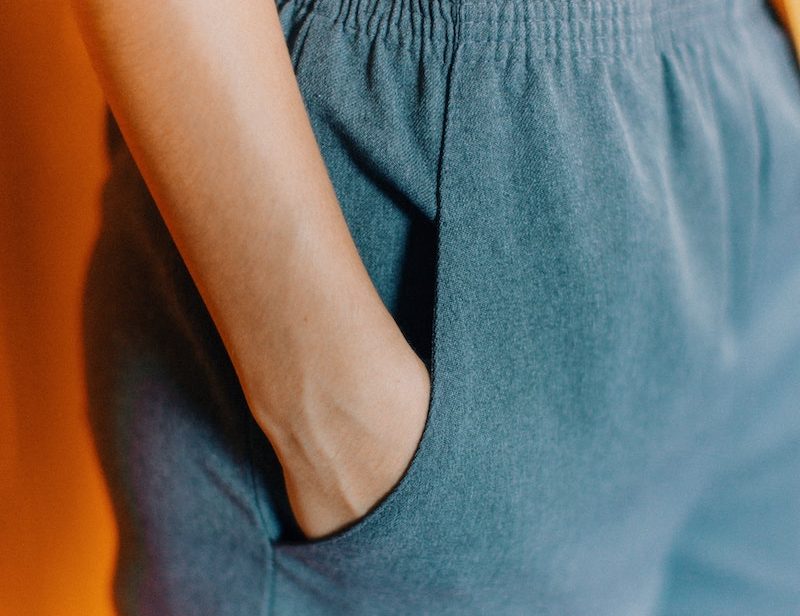 Close up of woman with hand in pocket