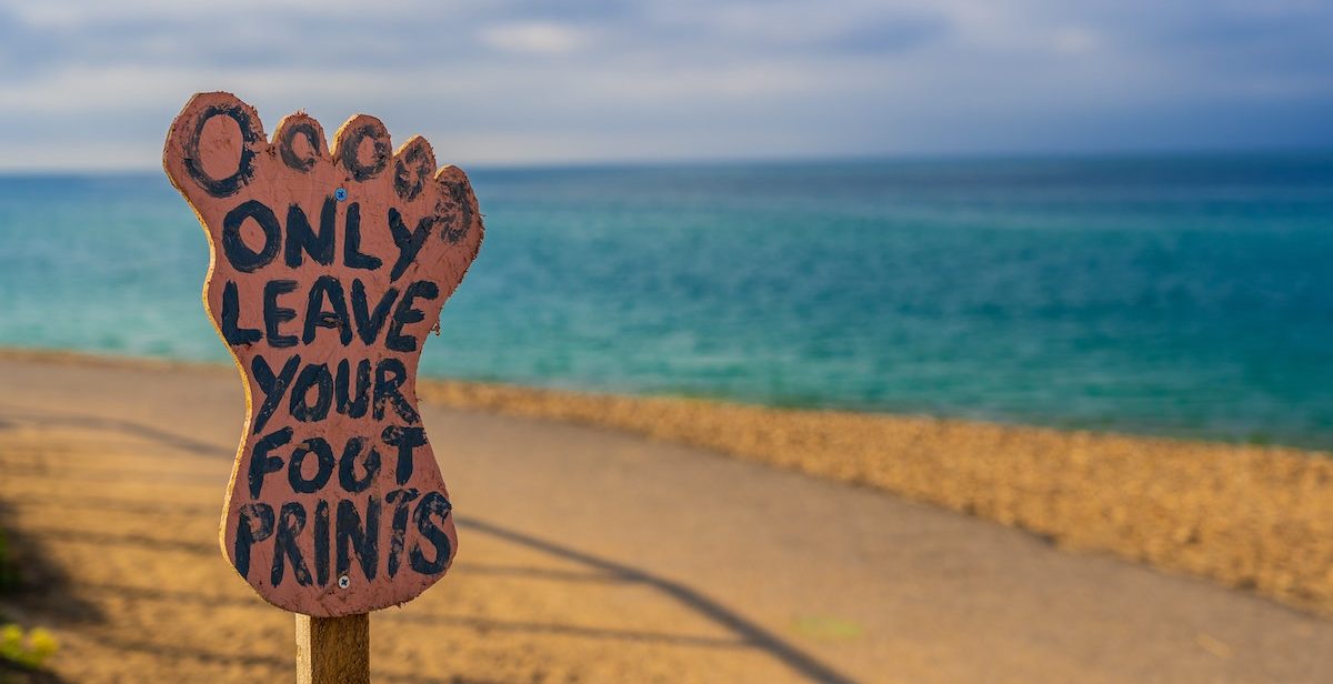 Beach with sign: only leave your footprints