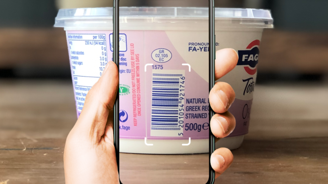 Phone scanning a yogurt pot barcode