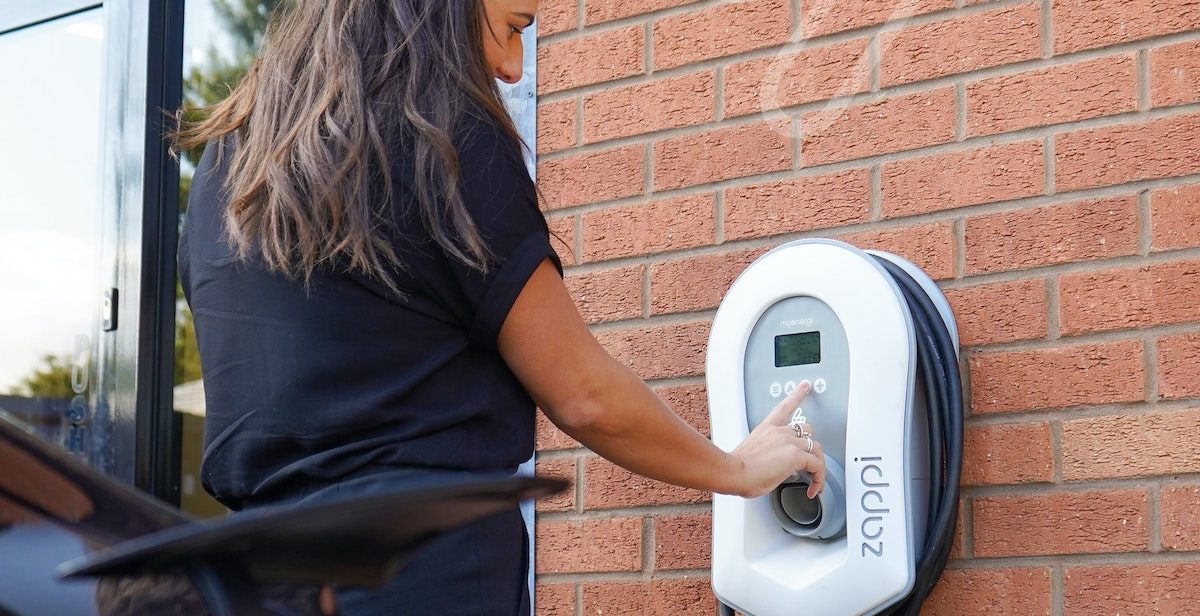 Woman using home charger