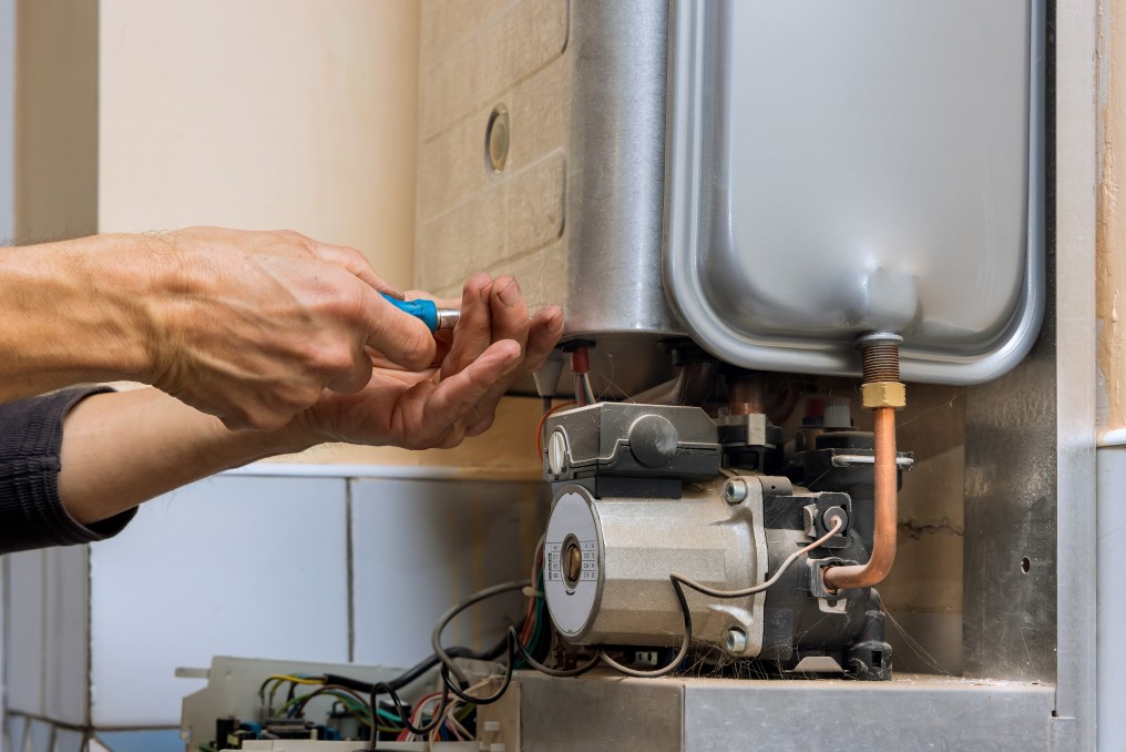 Engineer fixing a gas boiler