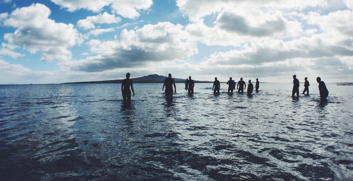 Men bathing in the sea