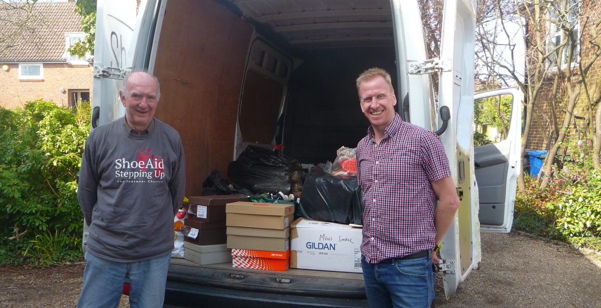 Two men and van full of shoes