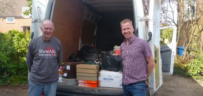 Two men and van full of shoes